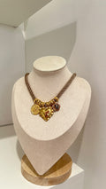 Collana cuore tre ciondoli beige